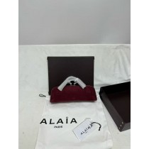 ALAÏA Le Teckel leather-trimmed suede clutch
